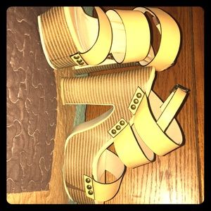 Never worn JUST FAB platforms.